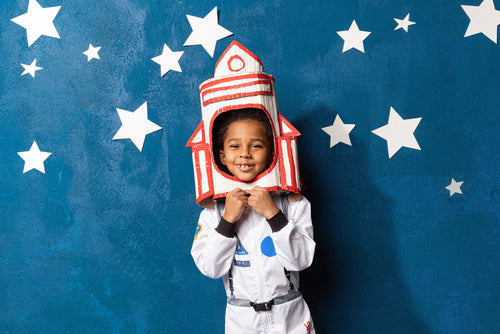 article image showing -Child wearing an astronaut costume with a rocket headpiece for space STEM activities