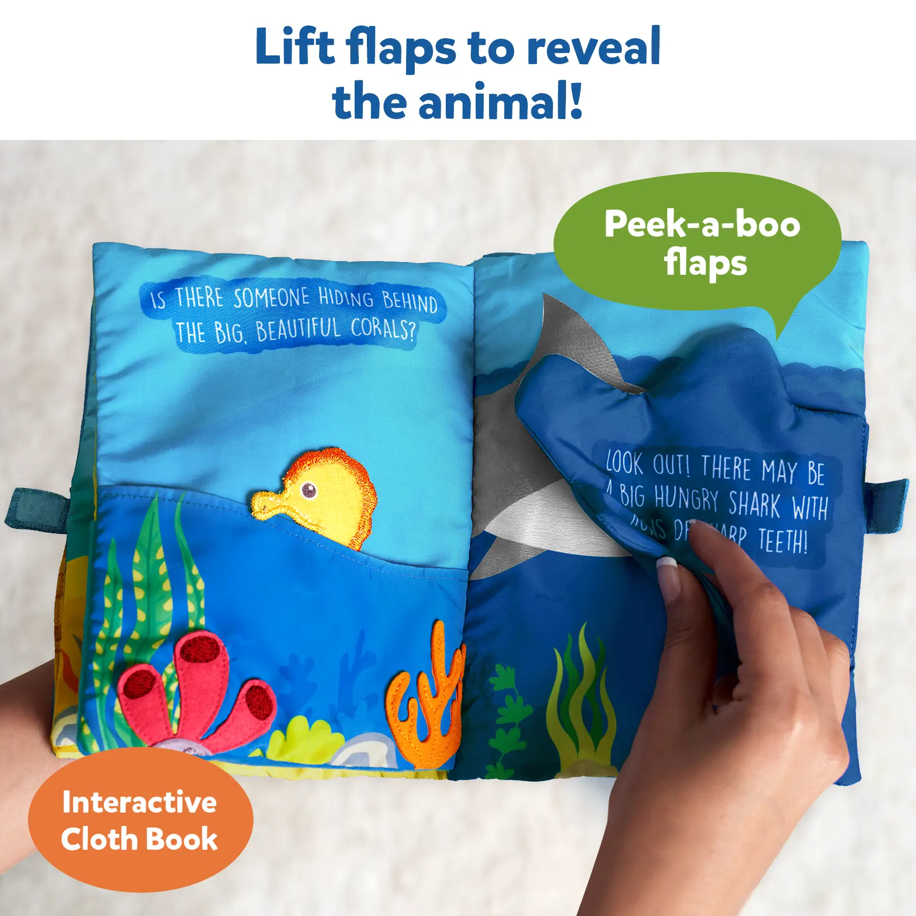 Interactive cloth book with peek-a-boo flaps featuring underwater animals for babies 6 months+