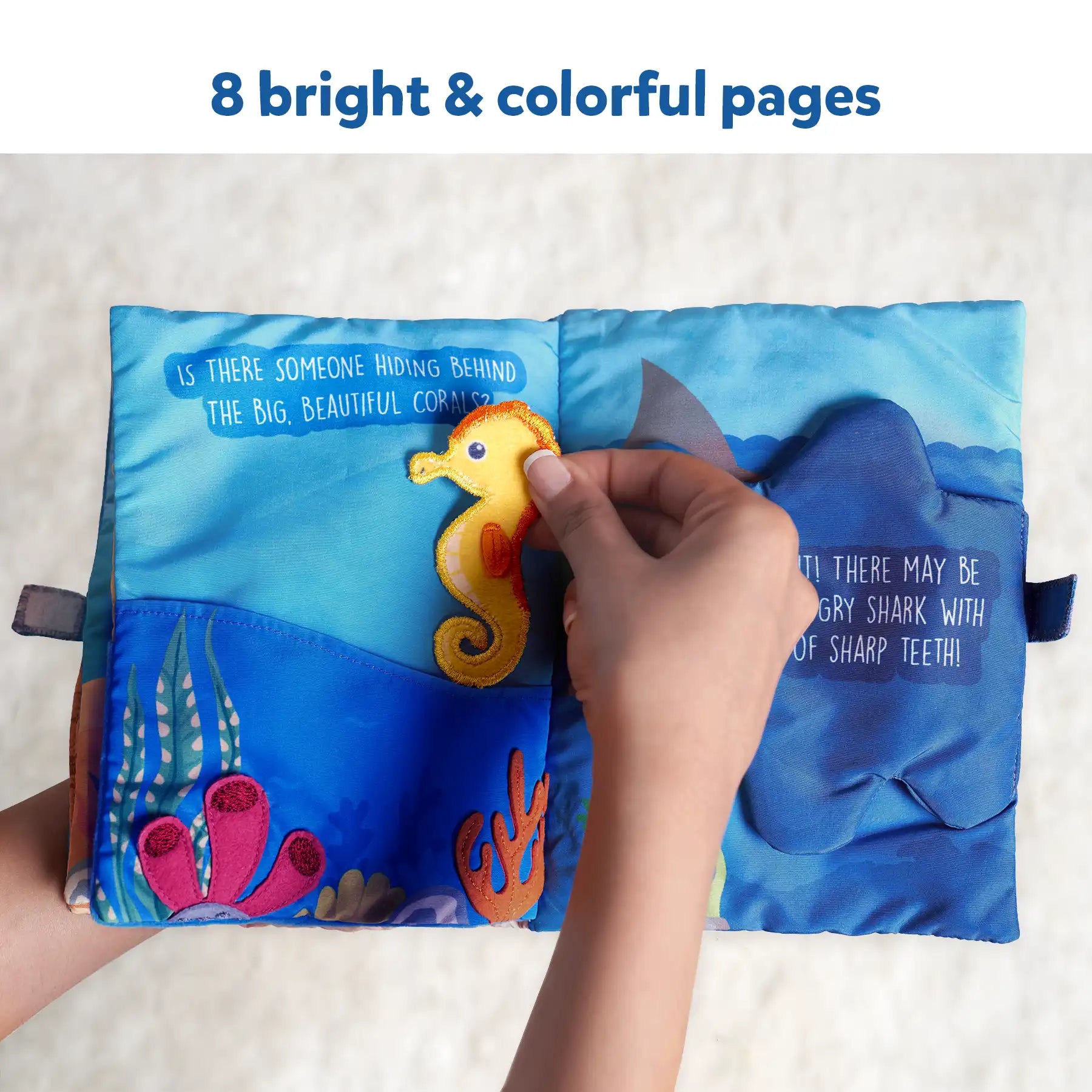 Interactive ocean-themed fabric book for babies featuring underwater animals