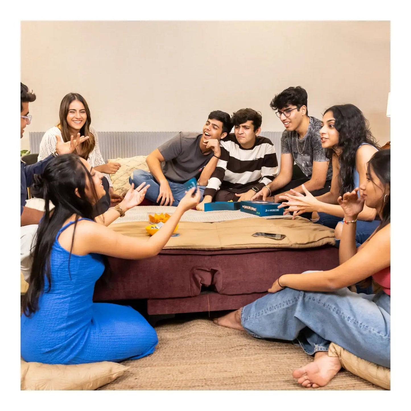 Group of young adults playing The Baffling Bowl game outdoors