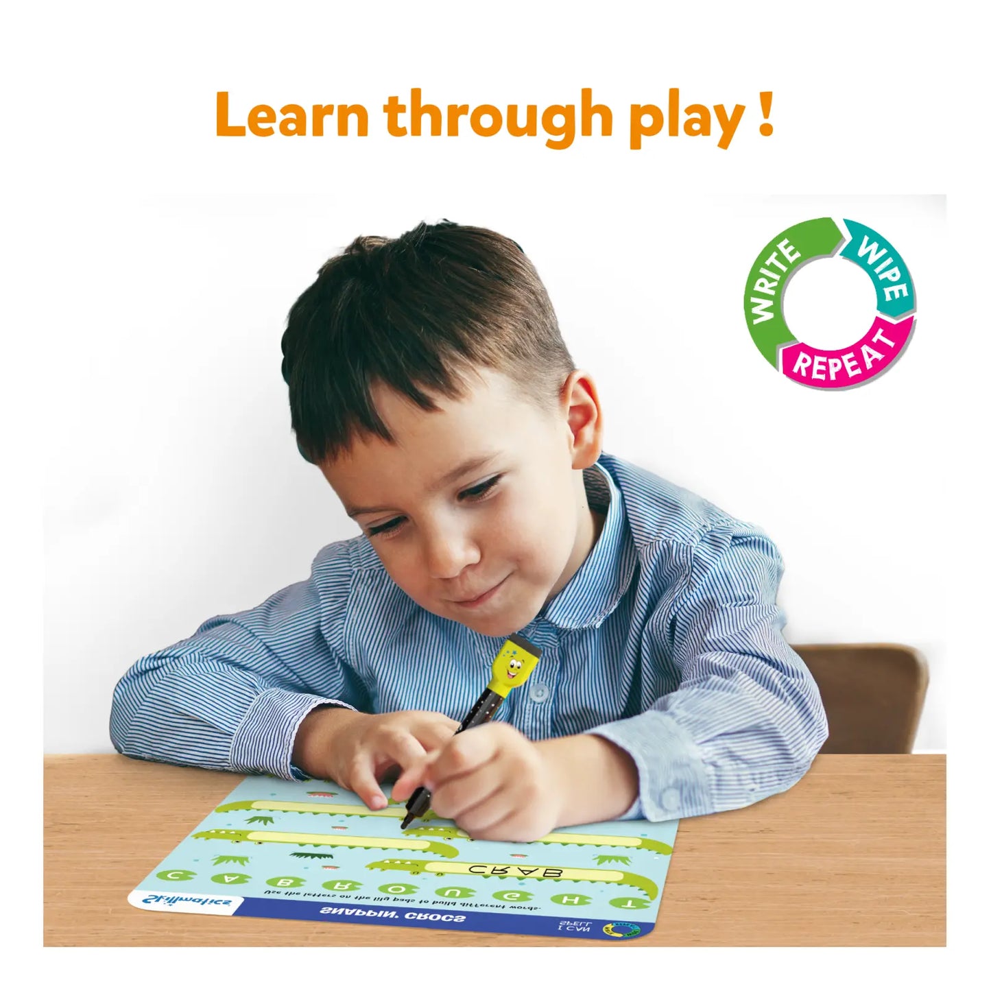 Child writing on a educational mat with 'Learn through play!' text and logo.