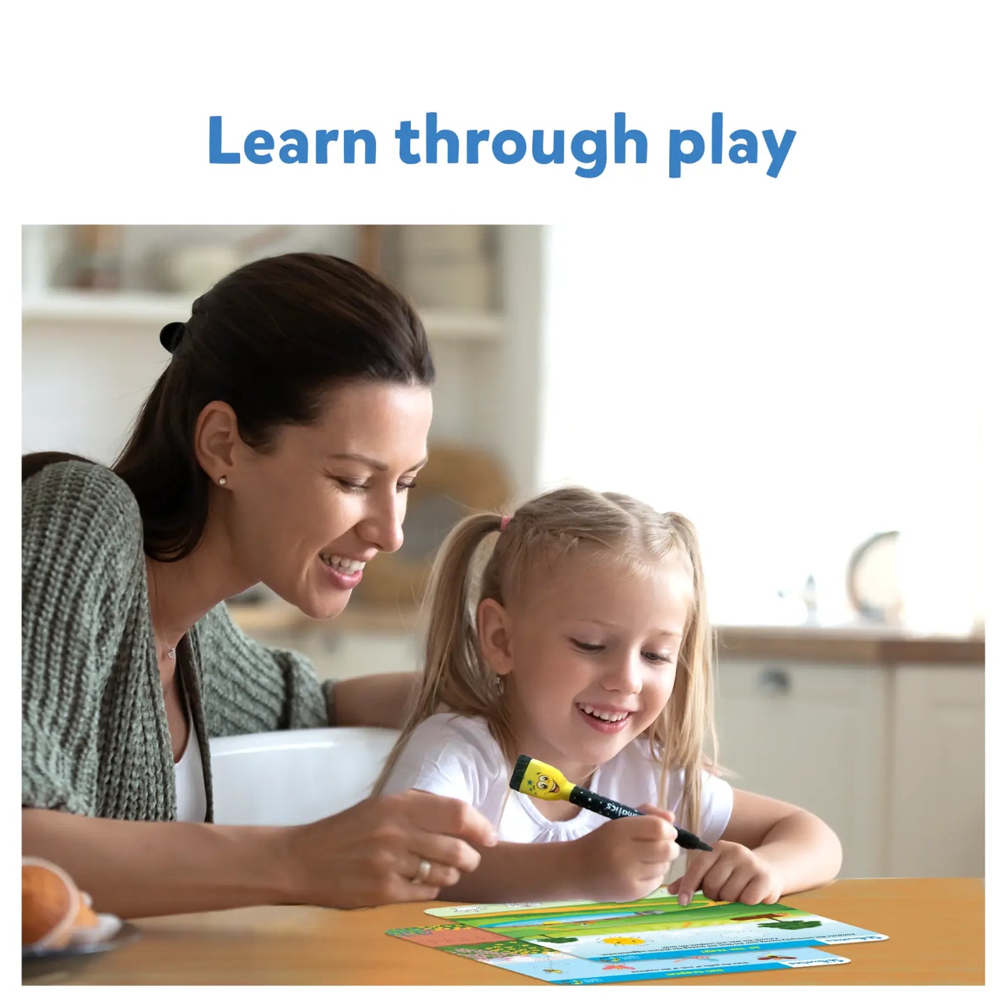 Smiling woman and child drawing with Write and Wipe I Can Write educational product