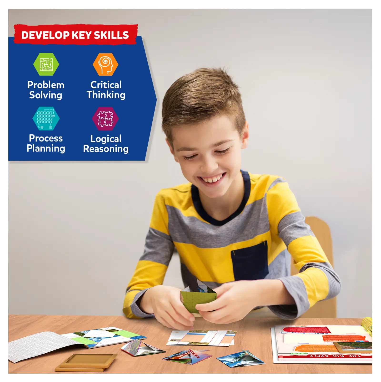 Smiling boy playing with Craft-O-Pedia All Around The USA origami puzzle book