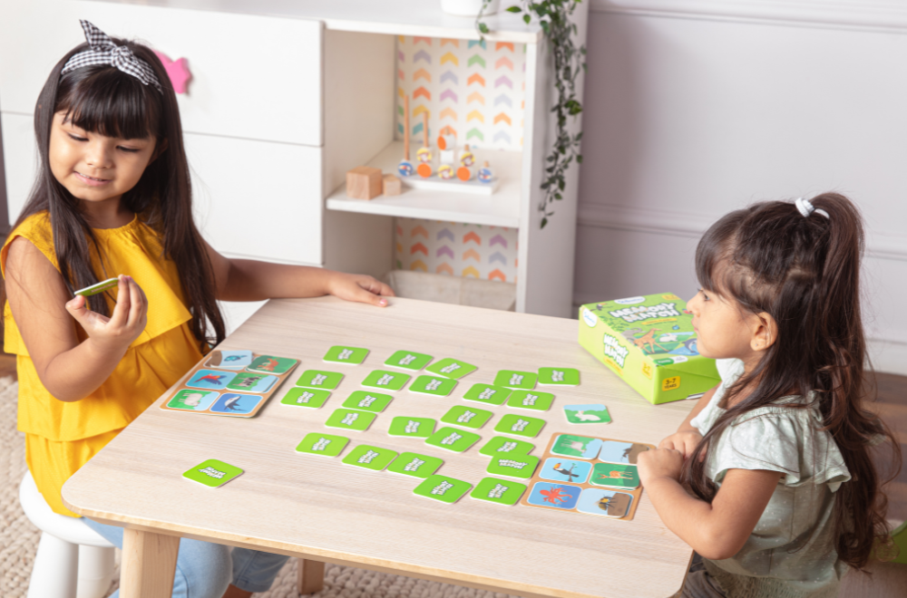 Two girls playing memory match