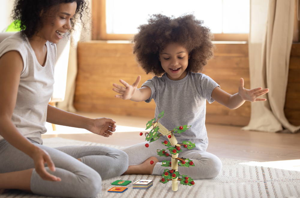 Girl and mother playing newton's tree