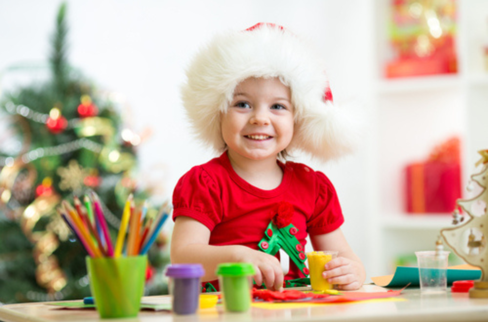 Kid doing Christmas very merry bingo by Skillmatics