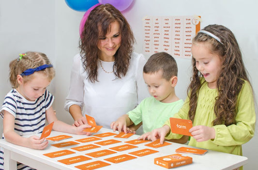 Kids playing with Skillmatics' sight words flash cards