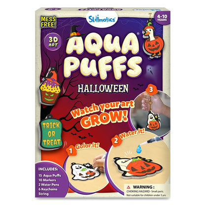 Skillmatics Aqua Puffs Halloween craft kit box for ages 4 to 10, marked Mess Free and 3D Art, with foam ornaments of a goose in a pumpkin, a witch-hat cupcake and a Trick or Treat sign, steps to color, water and grow the art, and a list of 15 puffs, 10 markers, 2 water pens, 6 keychains and string.