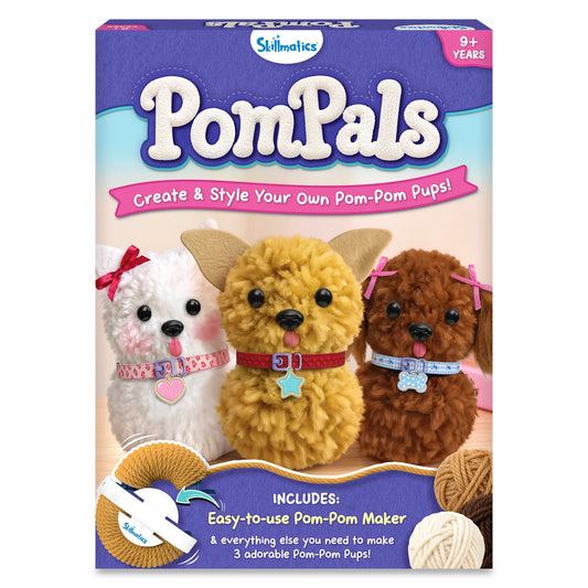 Skillmatics PomPals craft kit packaging for ages 9+, featuring three fluffy pom-pom puppies in white, yellow and brown, decorated with collars, bows and charms. The box highlights an easy-to-use pom-pom maker and materials for creating three adorable pups.