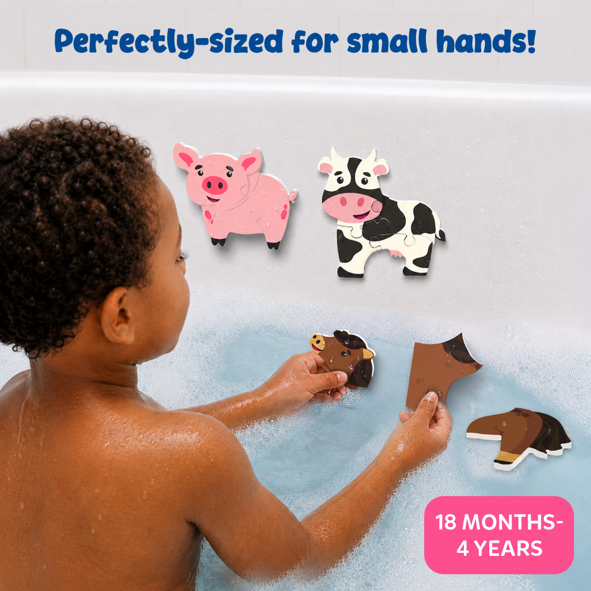 A young child plays in a bubble-filled bathtub while assembling soft foam farm animal puzzles. Completed pig and cow puzzles stick to the wet bath wall, while horse puzzle pieces are held in both hands. The image highlights perfectly sized pieces for small hands and suitability for ages 18 months to 4 years.
