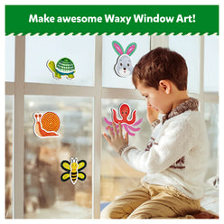 Child playing with colorful animal window clings from Waxy Window Art DIY Craft Kit