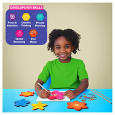 Smiling child creating flower art with Poke-in Art Flower Bouquet for kids ages 4-9
