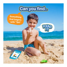 Smiling boy holding a seashell from Found It At the Beach Smart Scavenger Hunt for ages 4-7