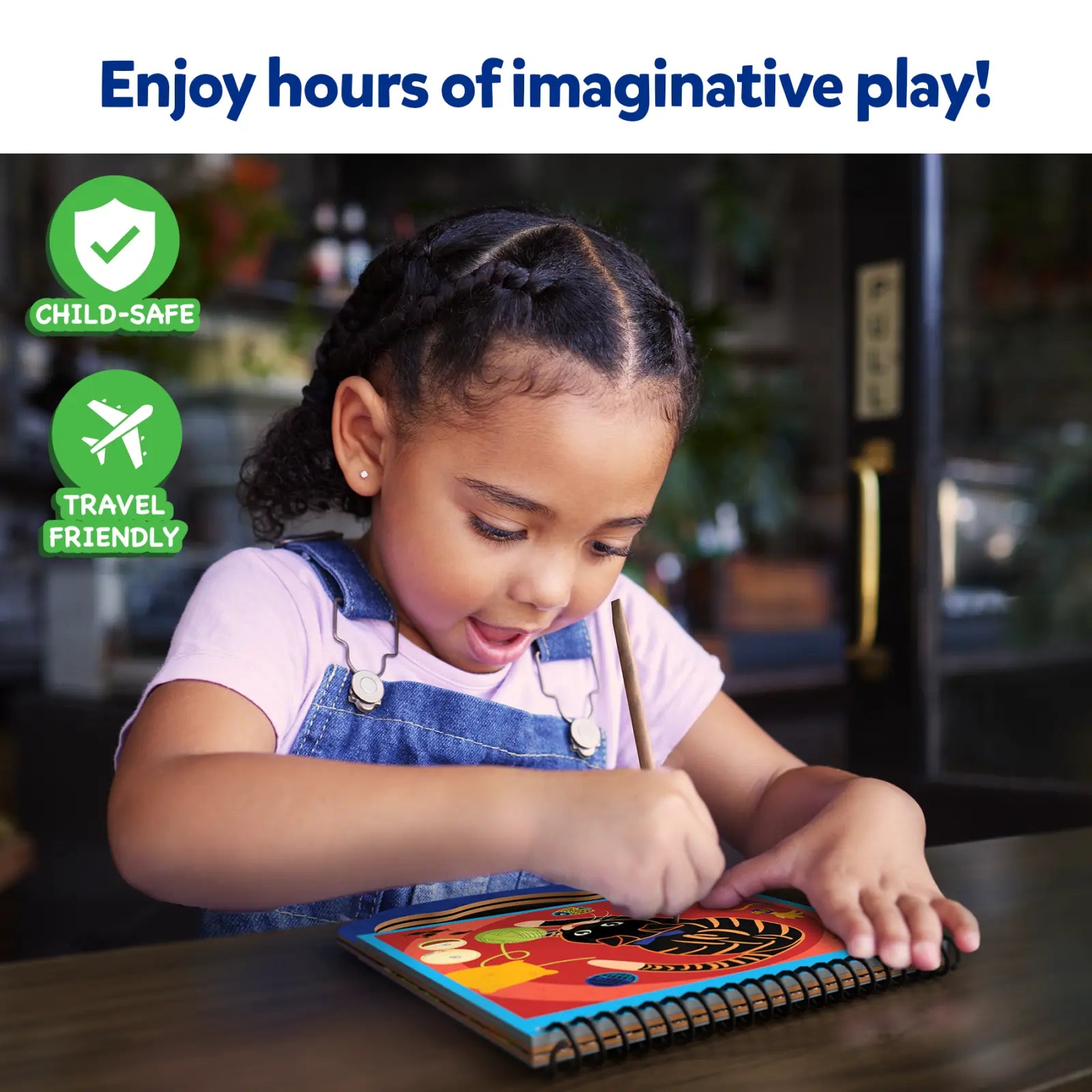 Child drawing in a colorful scratch art book from Magical Scratch Art Amazing Animals for ages 3-8